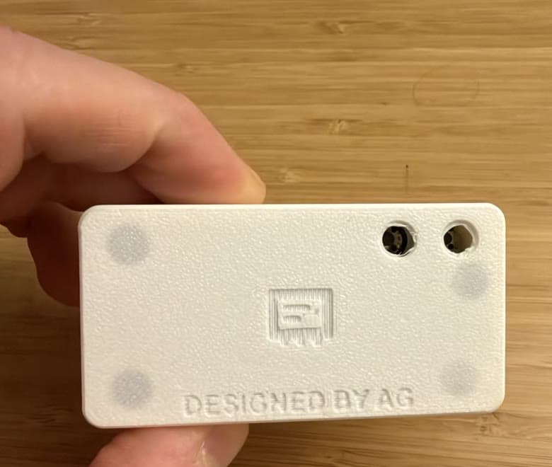 the back of the case: engraved logo, signature, and magnet pockets